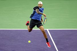Kyrgios striking the ball with power before retiring hurt.